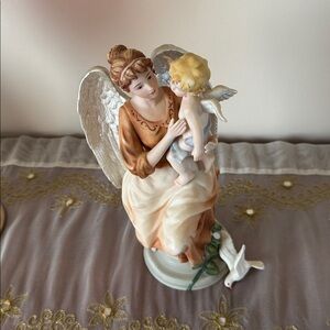 Porcelain Angel holding baby Cherub Hand Painted